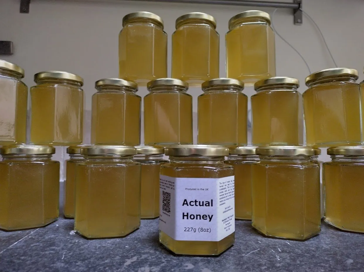 Rows of jars of Actual Honey